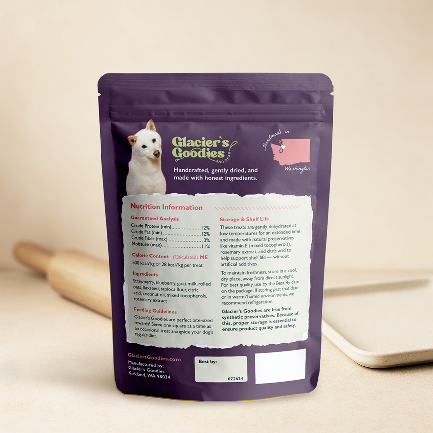 Purple package of Glacier's Goodies dog treats with nutrition information on a beige background