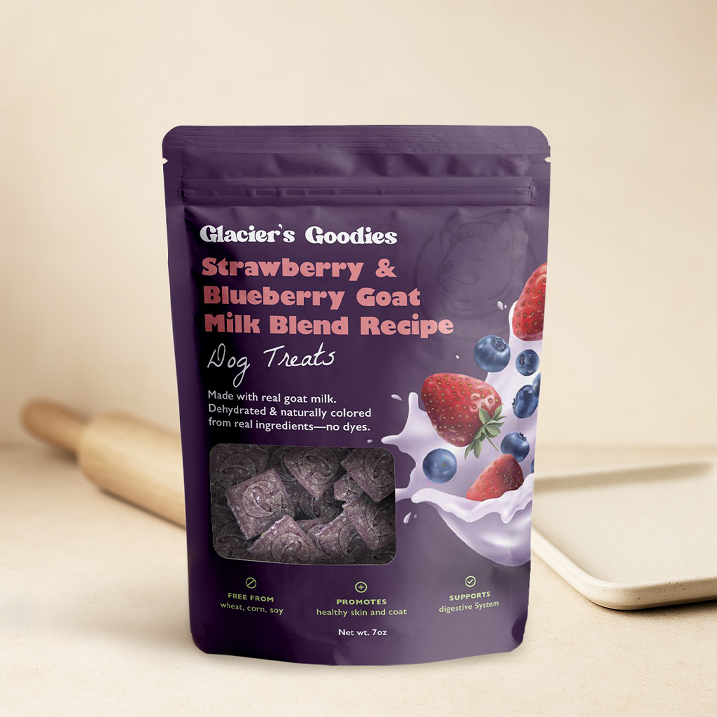Purple package of Glacier's Goodies Strawberry & Blueberry Goat Milk Blend Recipe dog treats on a beige background.