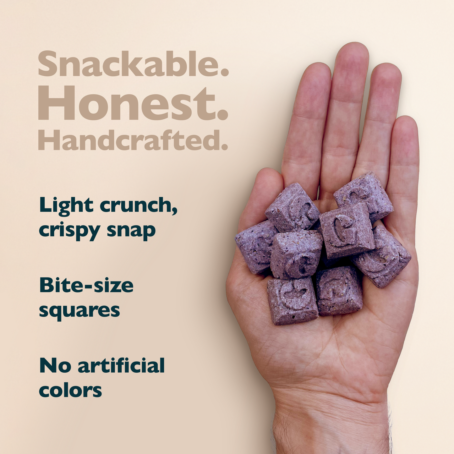 Hand holding purple snack squares with text about product attributes on a beige background