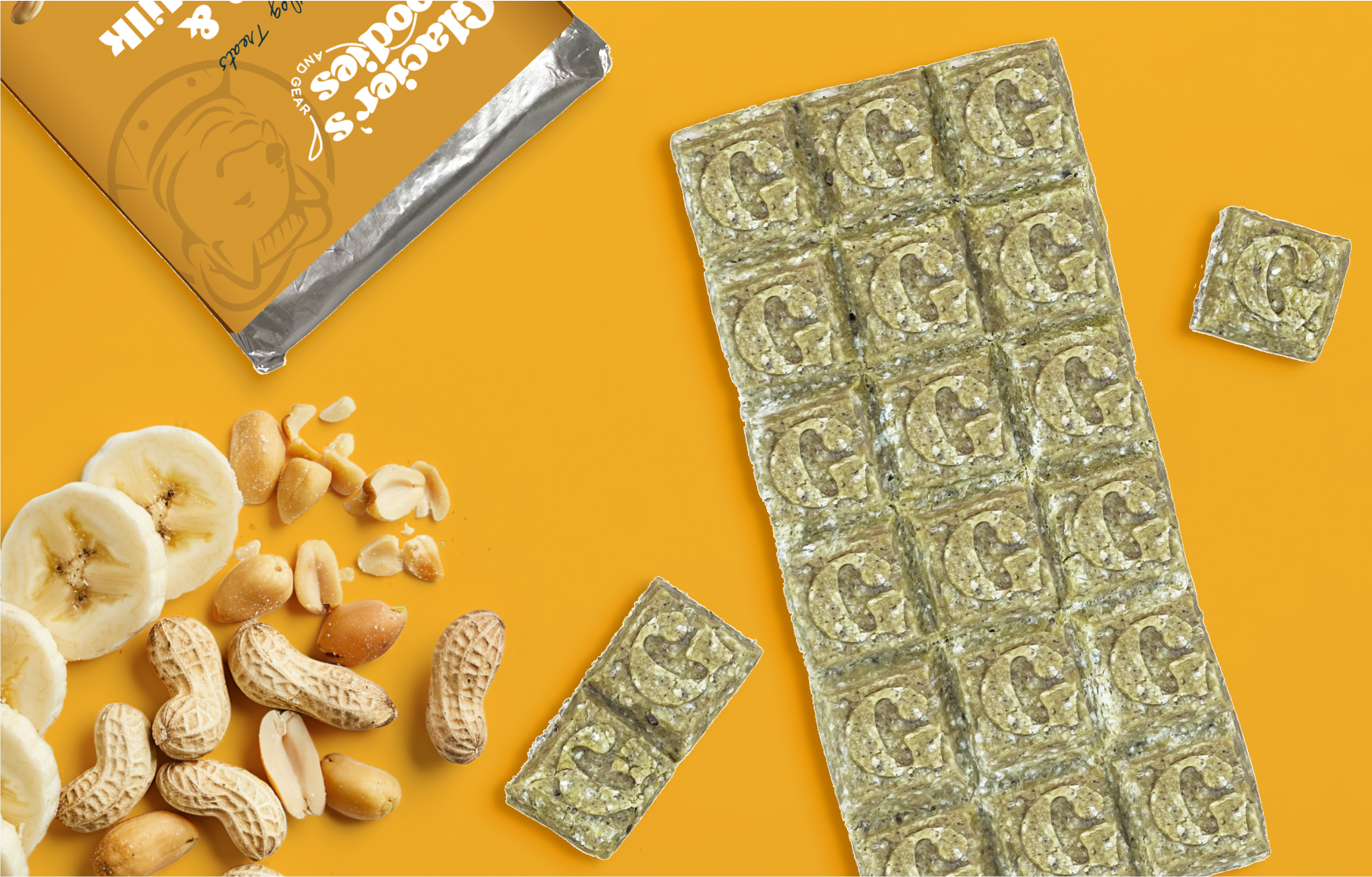 Unwrapped Banana and Peanut Goat Milk Dog Treat Bar laying on top of a wrapped bar